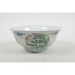 A Chinese doucai porcelain rice bowl with dragon and flaming pearl decoration, 6 character mark to