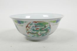 A Chinese doucai porcelain rice bowl with dragon and flaming pearl decoration, 6 character mark to