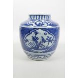 A Chinese blue and white porcelain jar with decorative panels depicting birds, insects and