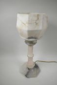 An Art Deco alabaster table lamp, with an original carved alabaster shade mounted on a column