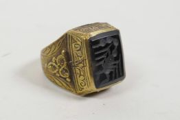 An Ottoman style brass intaglio ring