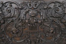 A fine C18th panel, possibly Flemish oak carving of scrolling foliate design, incorporating a lyre