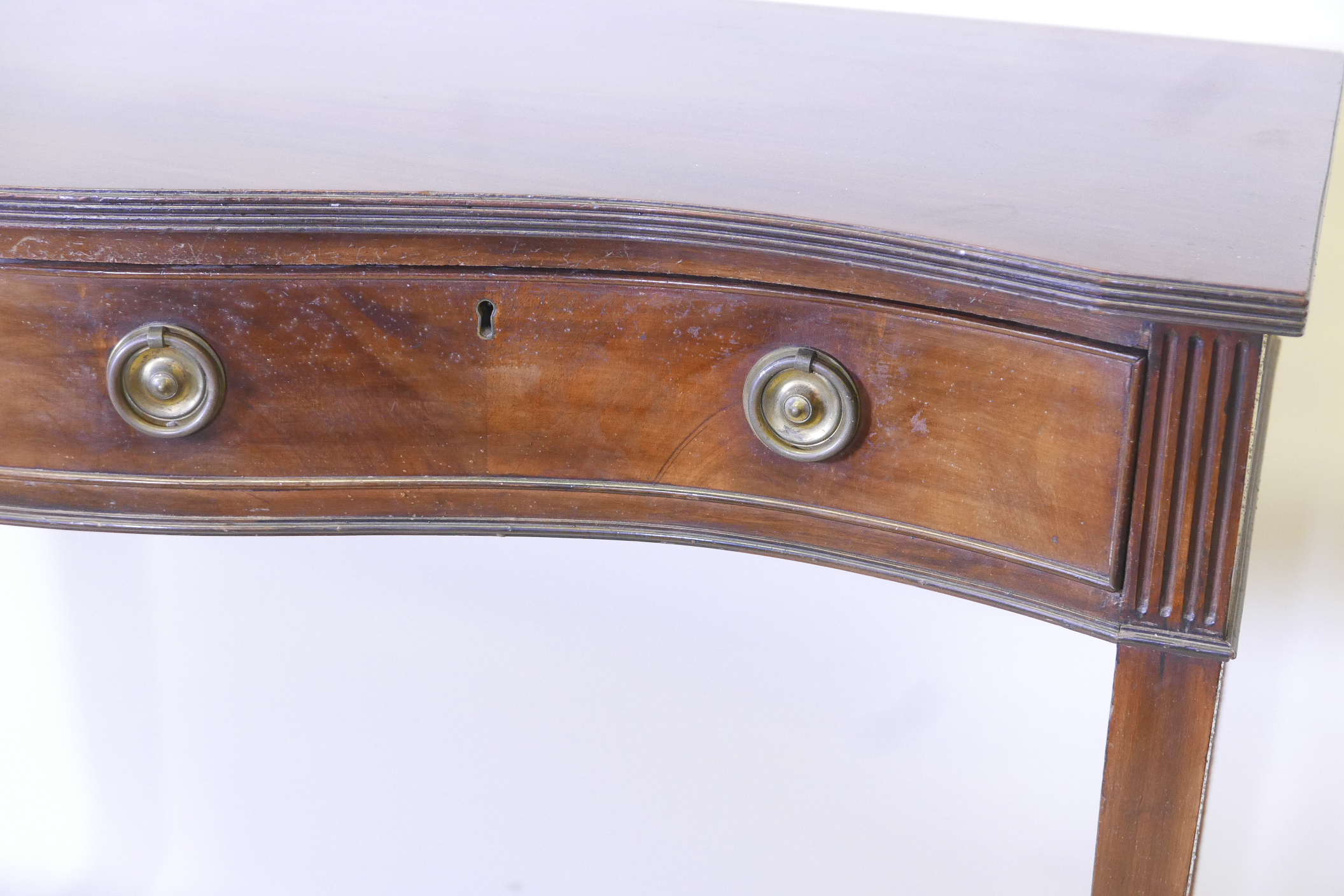 A C19th serpentine front mahogany serving table, with reeded edge top and two drawers with ring - Image 3 of 5