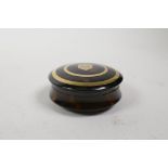 A gold inlaid tortoiseshell circular snuff box, 2½" diameter