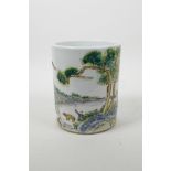 A Chinese famille verte porcelain brush pot decorated with a figure and animals in a landscape,