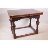 A late C19th/early C20th oak drawleaf table, raised on baluster supports united by stretchers, 30" x