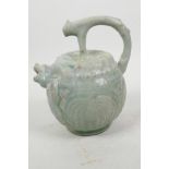 A Chinese green celadon glazed pourer with spout in the form of a mythical beast, 7" high