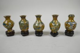 A set of five mid C20th Chinese miniature cloisonne vases, with stands, turquoise floral