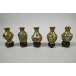 A set of five mid C20th Chinese miniature cloisonne vases, with stands, turquoise floral