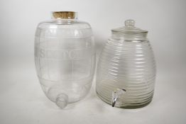 A large glass barrel engraved 'Fine Old Scotch', 13½" high, together with a beehive shaped ribbed