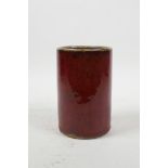 A Chinese red flambe drip glaze pottery brush pot, 5½" high x 3½" diameter