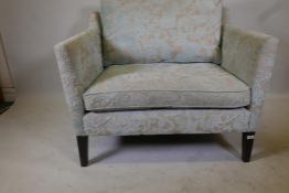 A Wesley Barrell love seat with floral upholstery