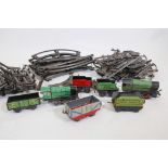 A quantity of Hornby O gauge track, clockwork, locomotives and rolling stock
