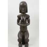 A bronze sculpture of a nude woman sitting on a stool, signed Bosice, 14" high
