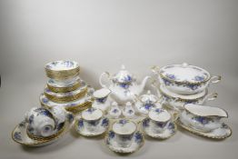 A Royal Albert Midnight Rose six place setting tea and dinner service to include a teapot, milk jug,