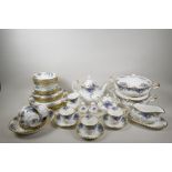 A Royal Albert Midnight Rose six place setting tea and dinner service to include a teapot, milk jug,