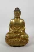 A Chinese gilt bronze of Buddha seated in meditation on a lotus throne, 10" high