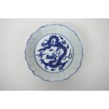 A Chinese blue and white porcelain dish of lobed form decorated with dragons in flight, 6