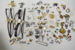 A quantity of costume jewellery, some silver, to include necklaces, brooches, cufflinks, watches,