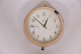 A Smith's eight day Bakelite wall clock, spring movement, painted case, appears in working order, 9"