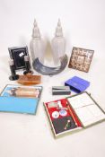 A Vera Wang picture frame and matching candlesticks, a gilt photo frame, Tom Dixon stapler,