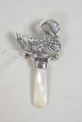 A sterling silver baby's rattle in the form of a swan with a mother of pearl handle, 3" long