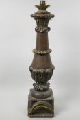 A turned oak column table lamp of classical form with carved and gilded embellishments, 22" high