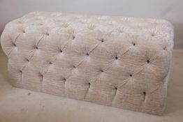 A buttoned, upholstered window seat, 54" x 22" x 24"