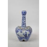 A C19th Chinese blue and white porcelain tulip vase with decorative panels depicting women in a