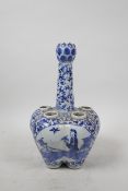 A C19th Chinese blue and white porcelain tulip vase with decorative panels depicting women in a