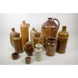 A collection of stoneware bottles, jars and large flagon, flagon 13" high