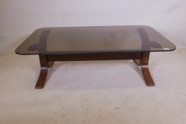 A French designer mid century bent ply and smoked glass coffee table, 27½" x 47½" x 15"