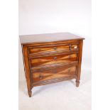 An inlaid mahogany chest of three long drawers by Woodbridge with three-quarter veneered top and