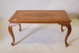 A Kashmiri teak and brass inlaid coffee table, raised on cabriole supports, 36" x 19" x 18"