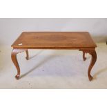 A Kashmiri teak and brass inlaid coffee table, raised on cabriole supports, 36" x 19" x 18"