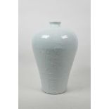 A Chinese celadon glazed porcelain meiping vase with underglaze dragon decoration, incised 4