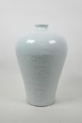 A Chinese celadon glazed porcelain meiping vase with underglaze dragon decoration, incised 4