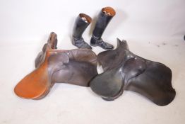 Two leather riding saddles, together with a pair of black leather riding boots, size 42/8