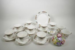 A Royal Doulton 'Autumn Fruits' set of eight teacups, seven saucers of 6" diameter and a cake plate,