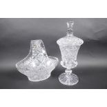 A cut lead crystal pedestal sweet jar and cover, 12½" high, together with a cut crystal basket fruit