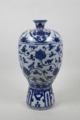 A Chinese blue and white Ming style vase with scrolling lotus flower decoration, 11½" high