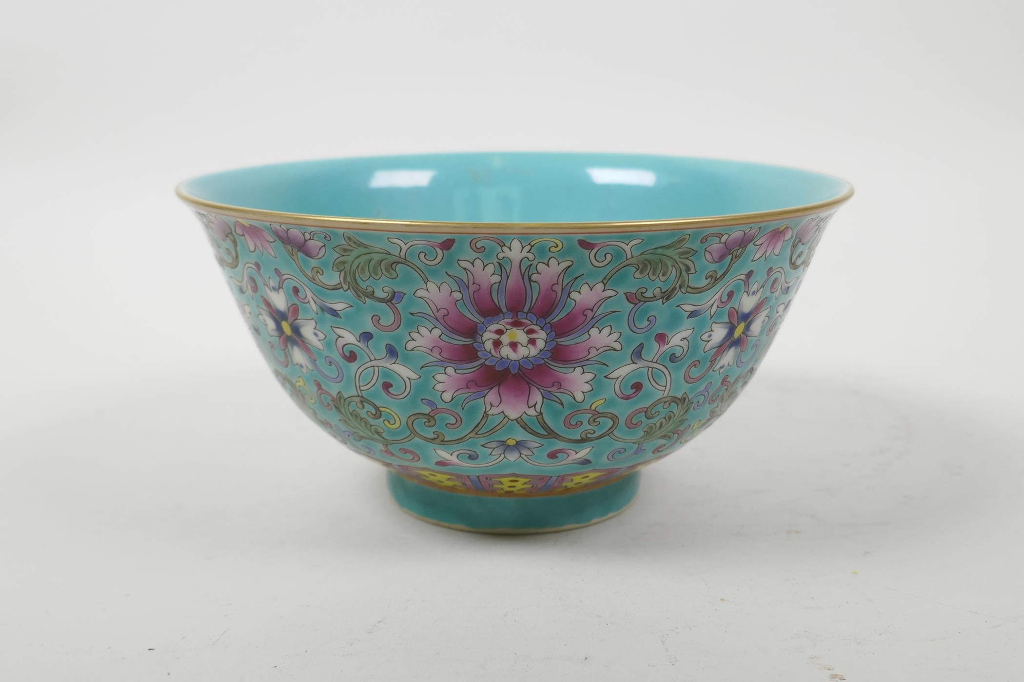 A Chinese polychrome porcelain rice bowl with enamelled scrolling lotus flower decoration, seal mark - Image 3 of 5