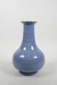 A Chinese blue ground crackleware vase with a ribbed neck, 9" high
