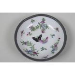 An Chinese porcelain dish painted with butterflies and flowers in an pewter outer frame, 6" diameter