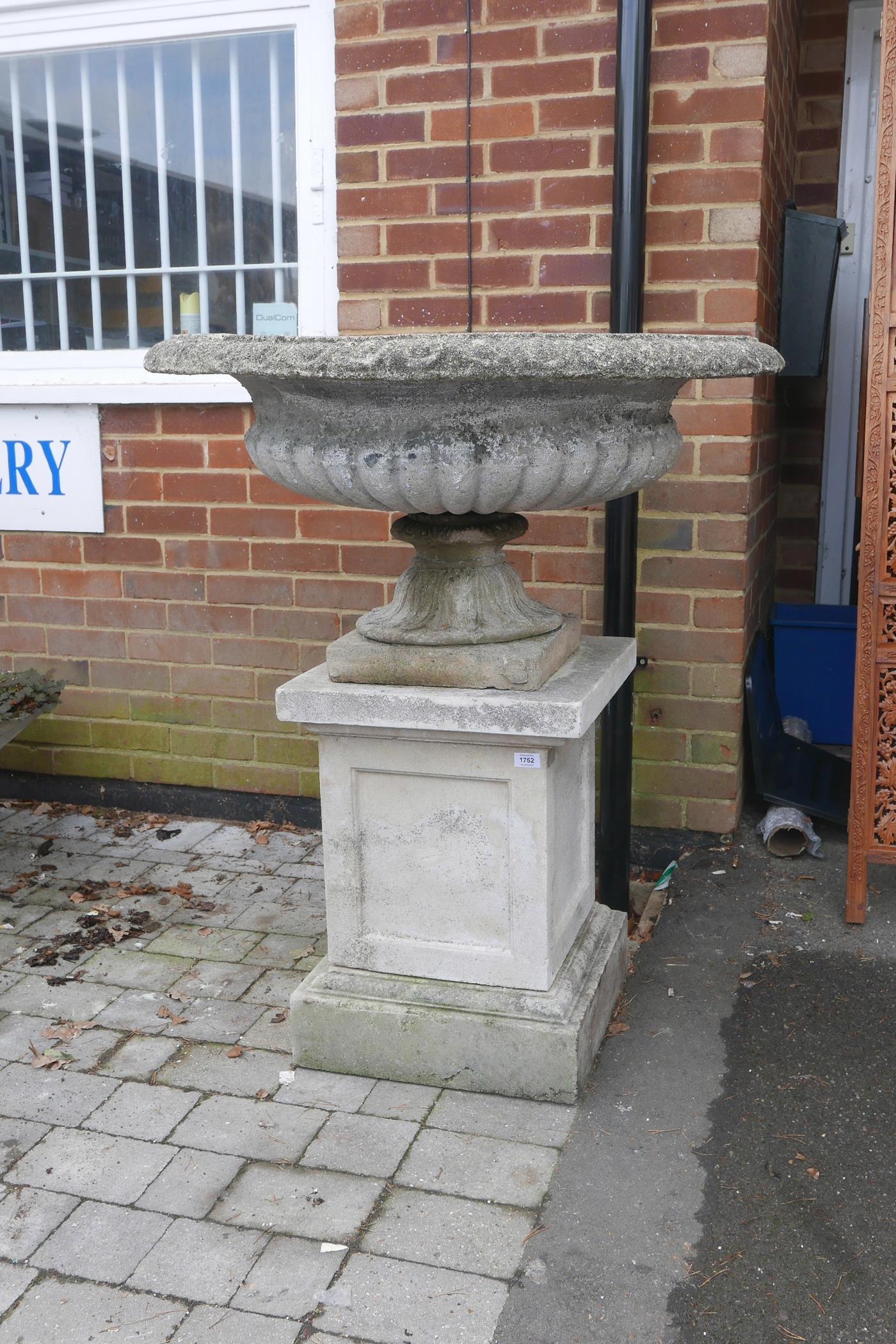 A reconstituted Campagna urn on stand, 44" high x 37½" diameter