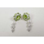 A pair of silver, cubic zirconium and peridot earrings with snake shaped drop, 2" long