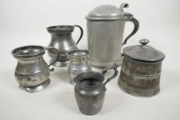 A collection of C18th pewter vessels including a large lidded tankard, English c.1780, with double