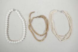 Two multi-strand pearl necklaces, one A/F, and a string of shell beads, 16" long