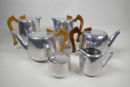 A collection of Picquot ware, two teapots, two coffee bowls, a cream jug and sugar bowl (6)