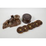 A set of six turned wood lignum vitae coasters set with 1947 Jamaican farthings, together with a